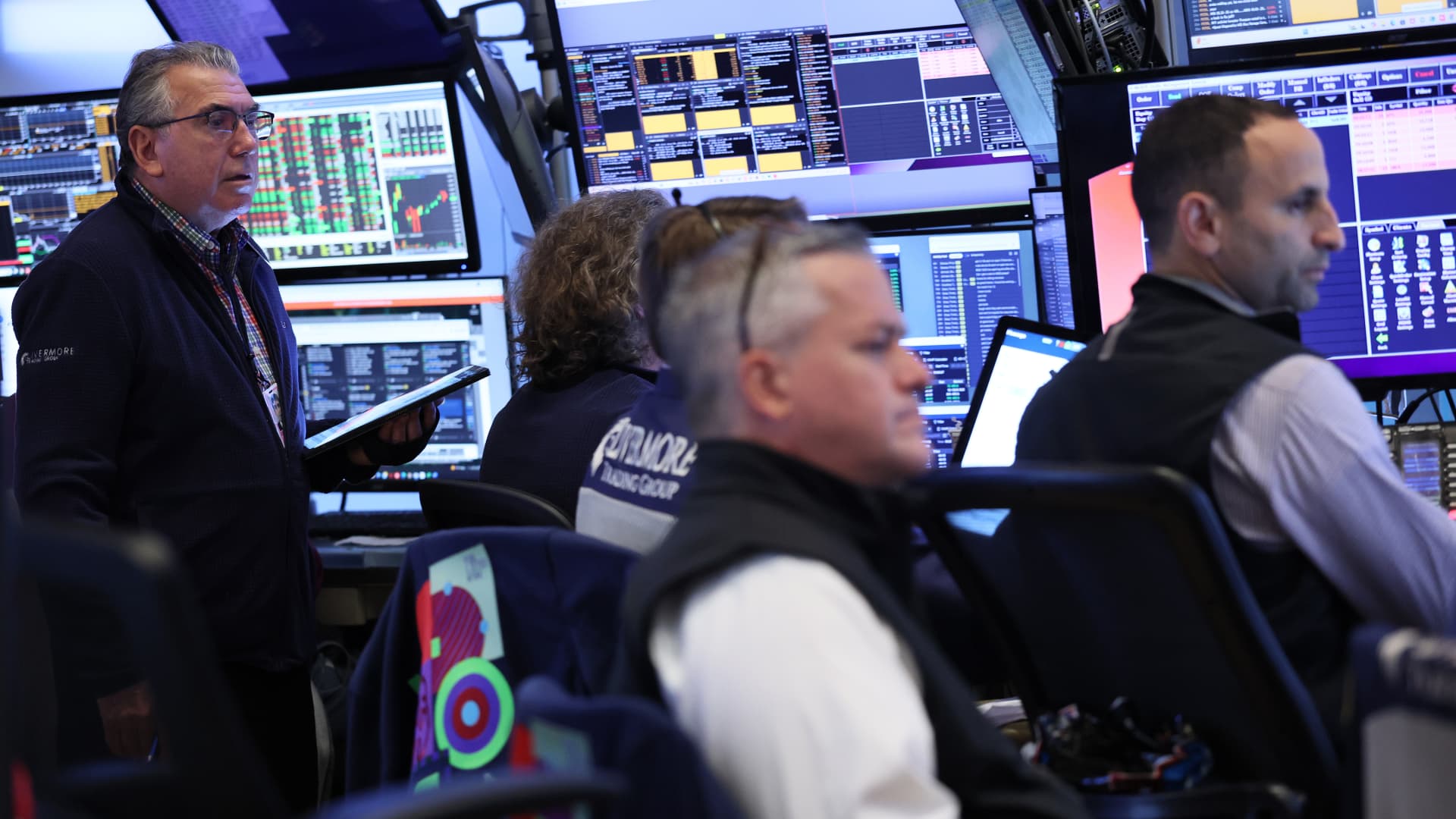 Stocks pull back from record highs as Wall Street takes a breather