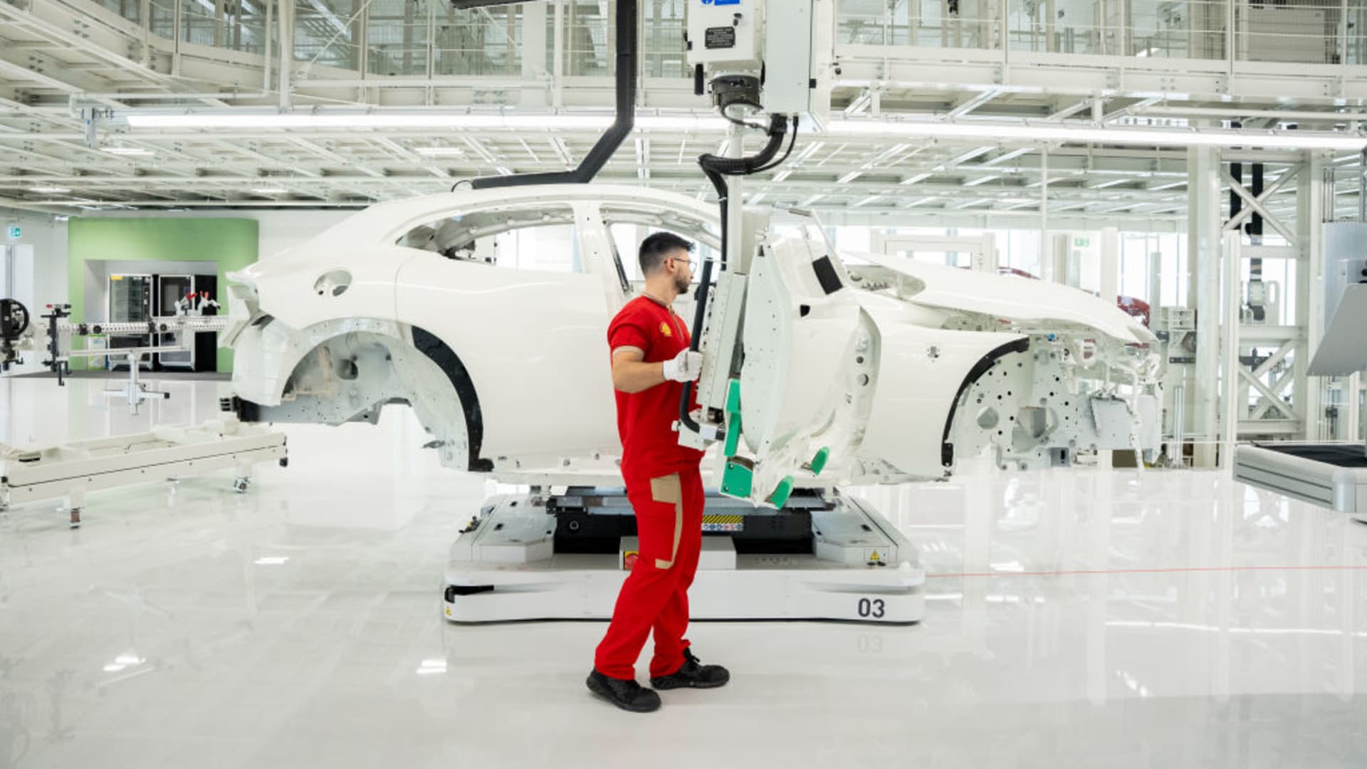 Ferrari unveils first electric vehicle and cuts 2030 EV sales target